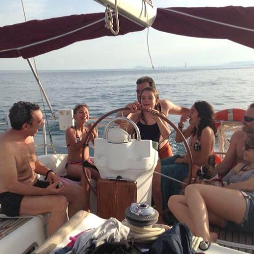 a group of people sitting on a boat in the water