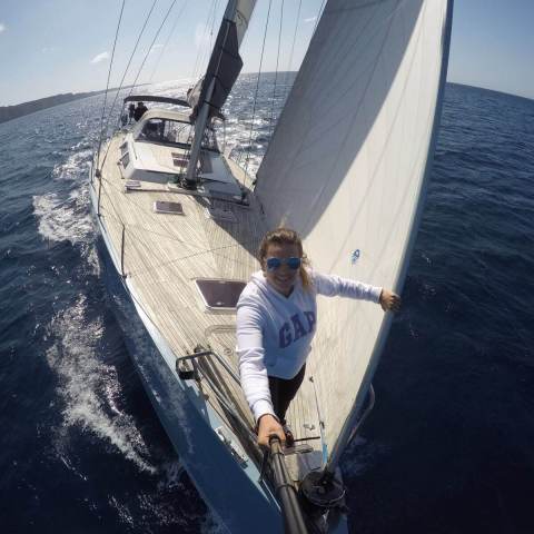 a man standing next to a body of water