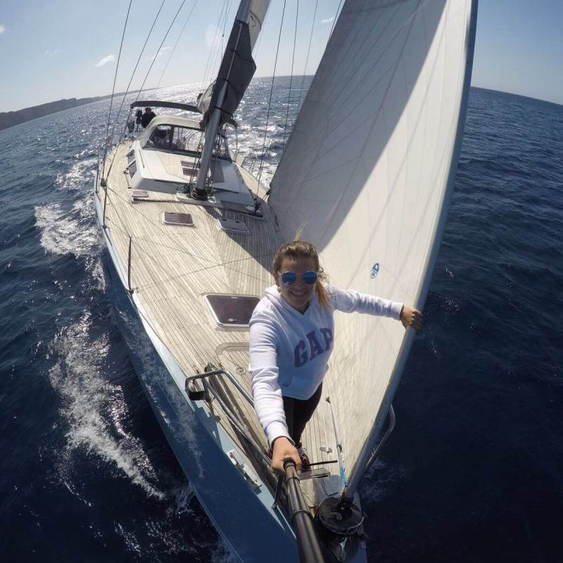 a man standing next to a body of water
