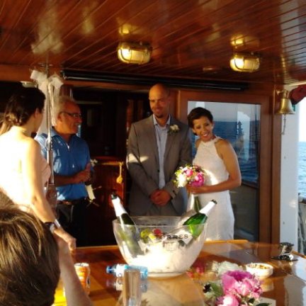 a group of people sitting at a table in a restaurant