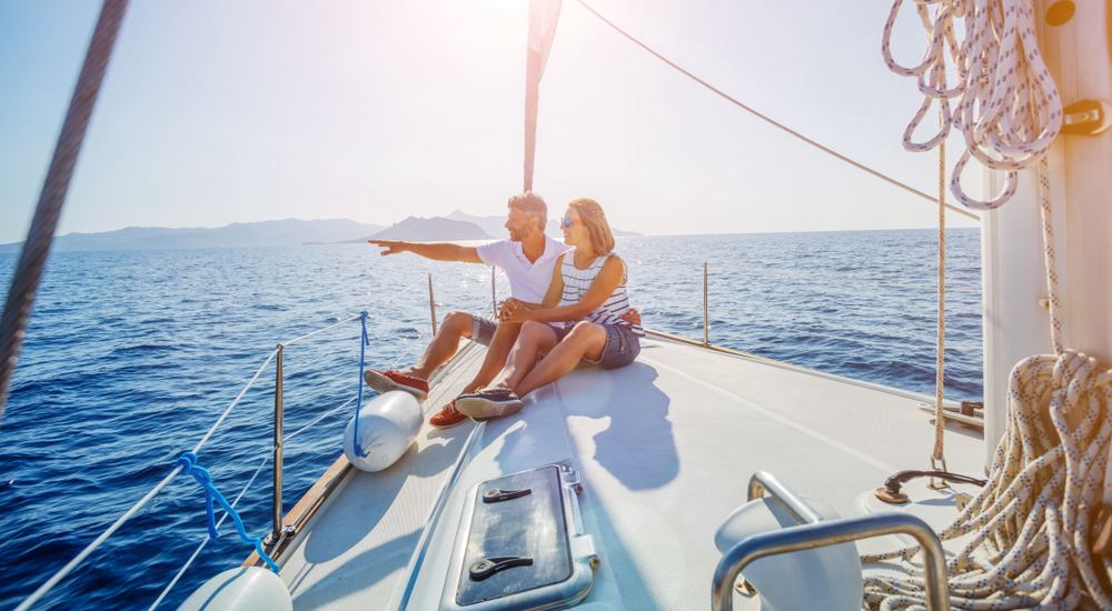 a person sitting in a boat on a body of water