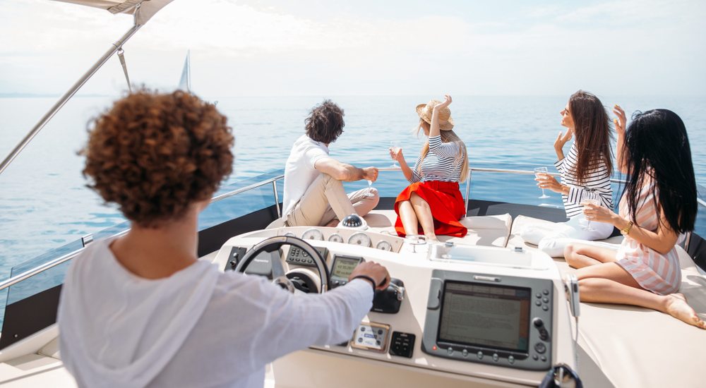 a group of people on a boat looking at the camera