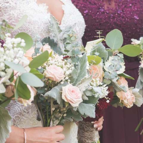 a hand holding a flower