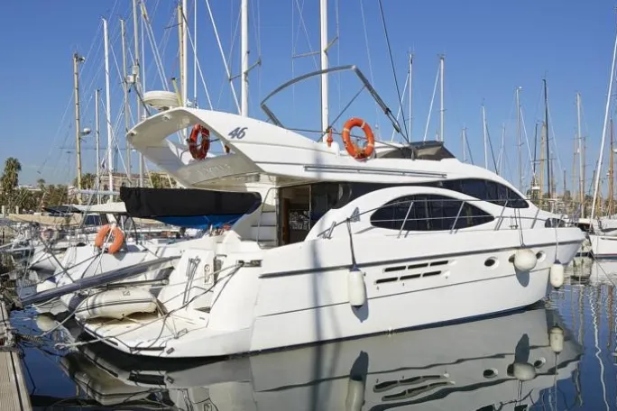 a boat is docked next to a body of water