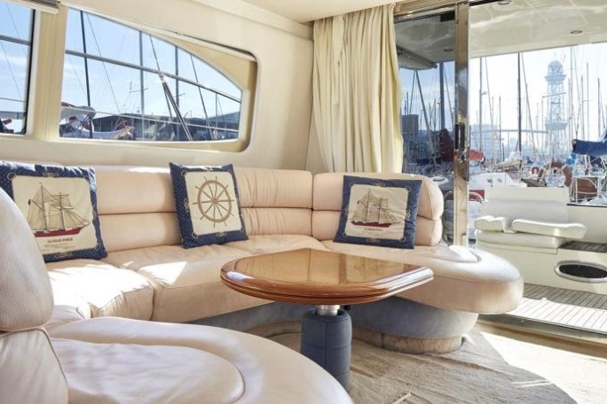 a living room filled with furniture and a large window