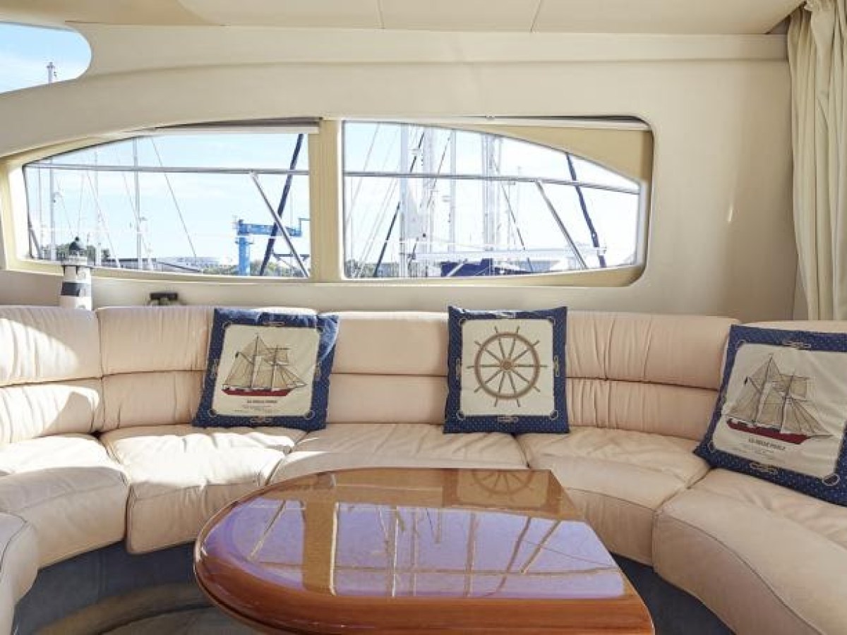 a living room filled with furniture and a large window