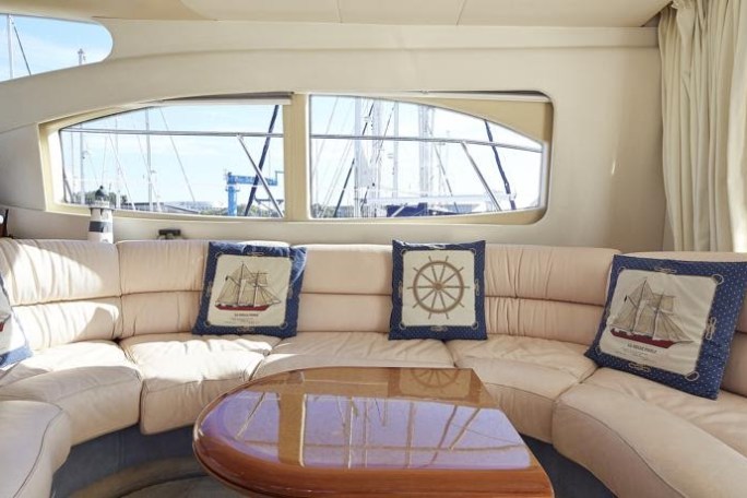 a living room filled with furniture and a large window