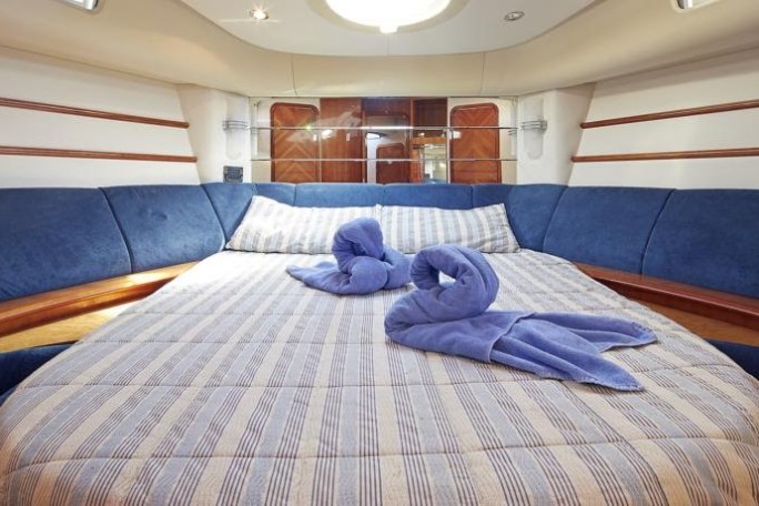 a bedroom with a bed in a room