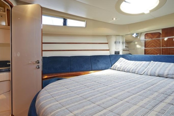 a bedroom with a large bed in a room