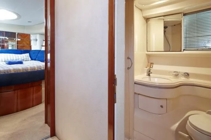 a white sink sitting under a window