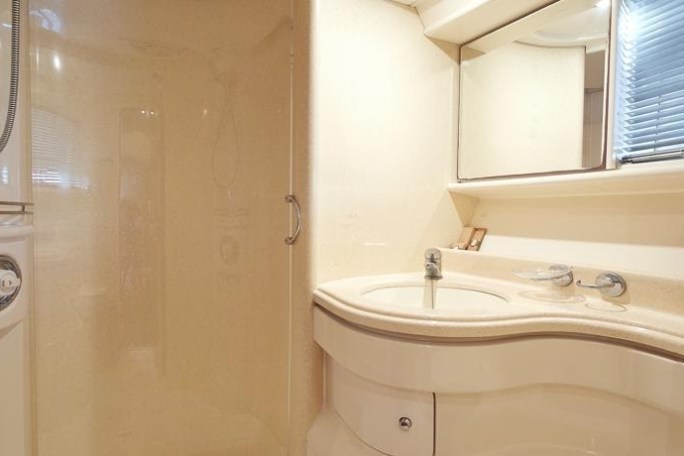 a white tub sitting next to a sink