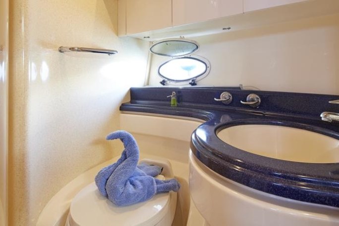 a white tub sitting next to a shower