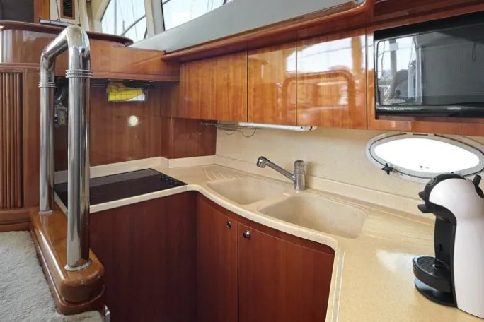 a kitchen with wooden cabinets and a sink