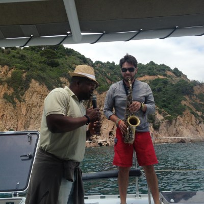 a man standing on a boat in the water