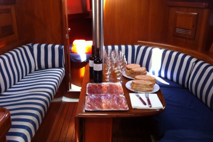 a cup of coffee sitting on top of a wooden table