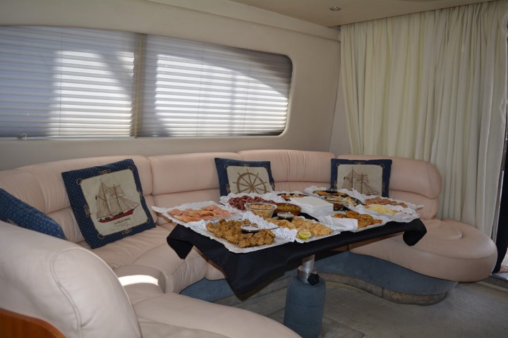 a pizza sitting on top of a bed next to a window