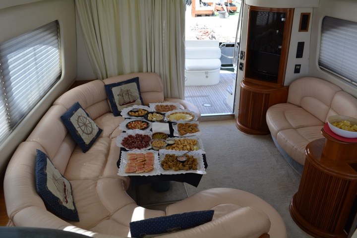 a living room with a bed and a chair