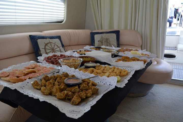 a plate of food sitting on a bed