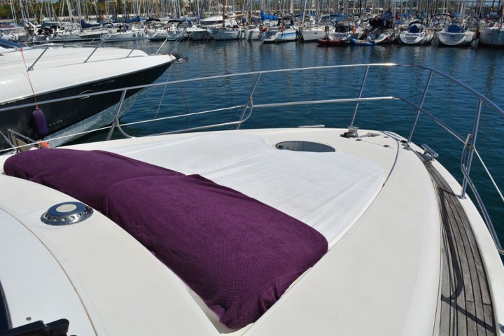 a boat is docked next to a body of water