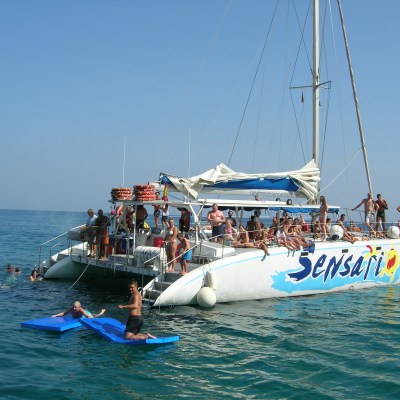 a group of people on a boat in the water