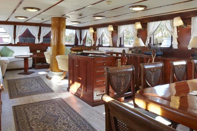 a room filled with furniture and vase on a table