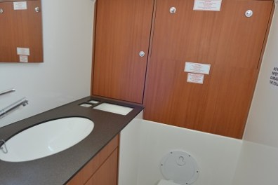 a kitchen with a sink and a mirror