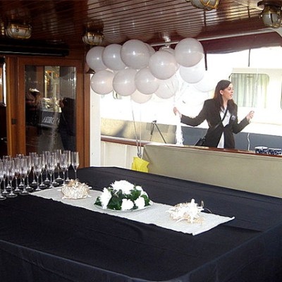 a person sitting at a table with a cake
