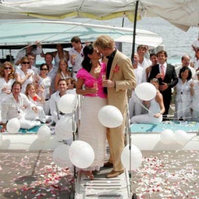 a group of people sitting at a table in front of a crowd