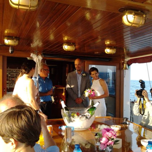 a group of people sitting at a table in a restaurant