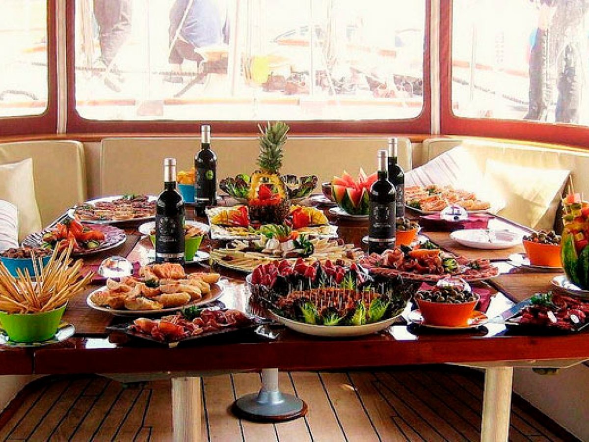 a person sitting at a table with a plate of food