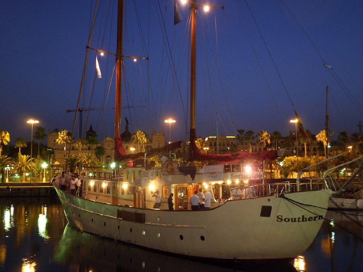 a boat is docked next to a body of water
