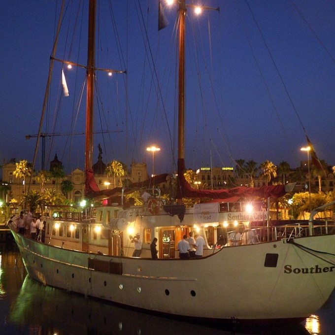 a boat is docked next to a body of water
