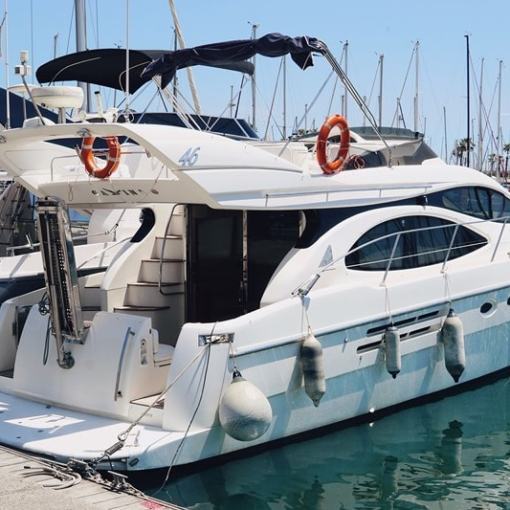 a yacht is moored in Port Olimpic Barcelona