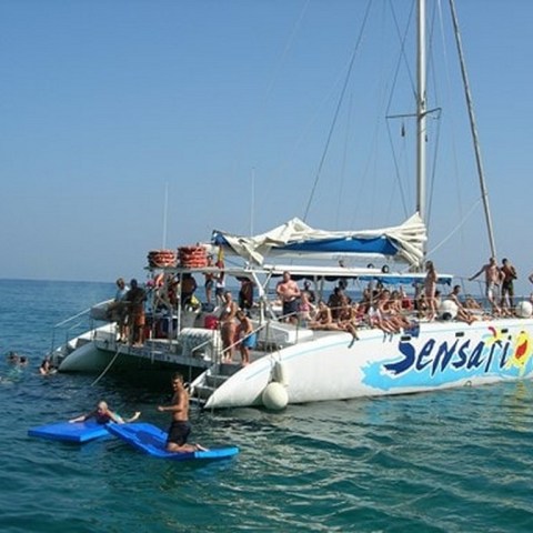 a group of people on a boat in the water