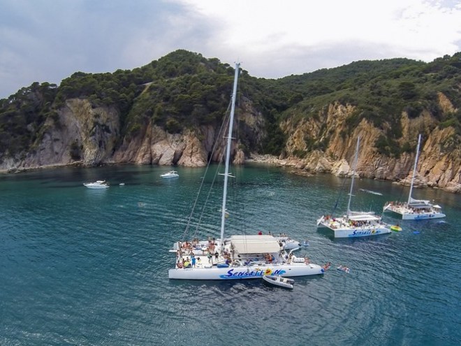DCIM101GOPRO 3 catamarans of the catamaran sensation fleet on a bay