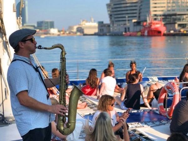 Saxophonist is playing in catamaran