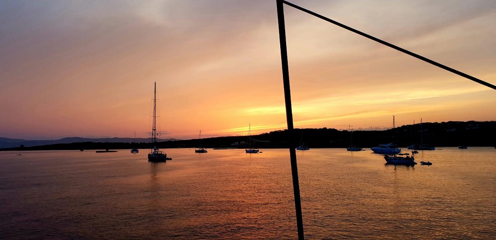 a sunset over a body of water