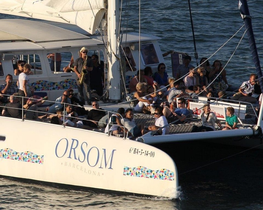 a group of people in a boat on a body of water