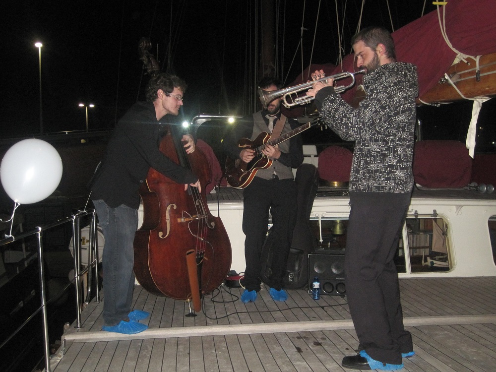 a group of people playing instruments and performing on a stage