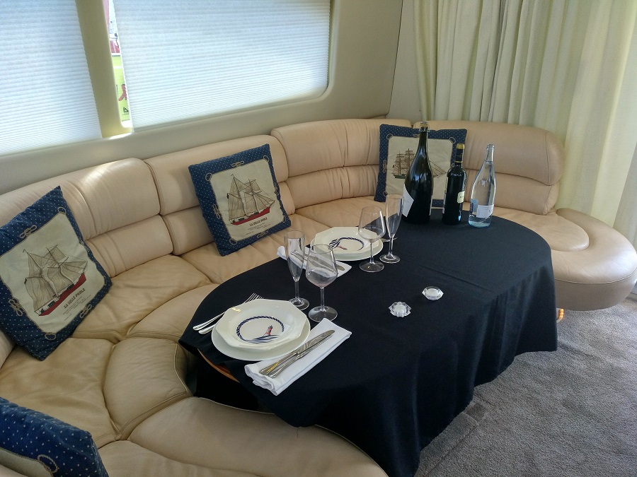 a room in a boat with a couch and a table