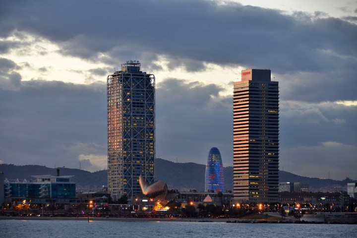 a large body of water with a city in the background
