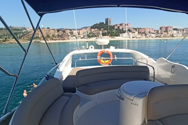 a boat sitting next to a body of water
