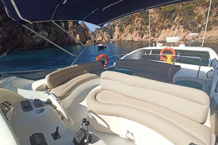 a boat sitting on top of a car