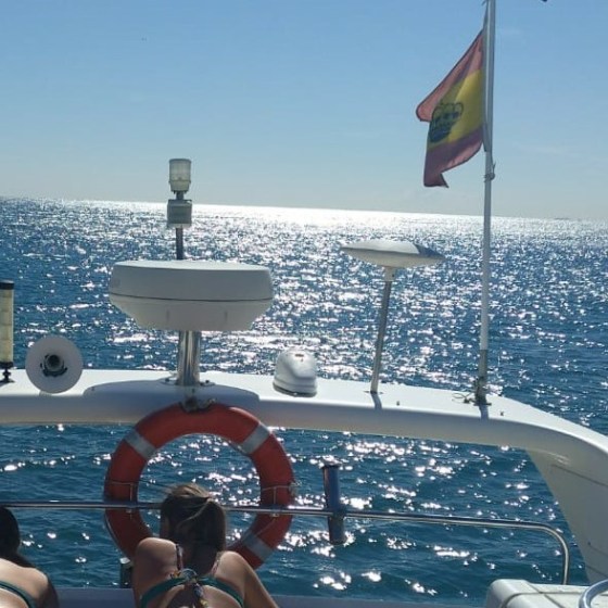 a group of people in a boat on a body of water